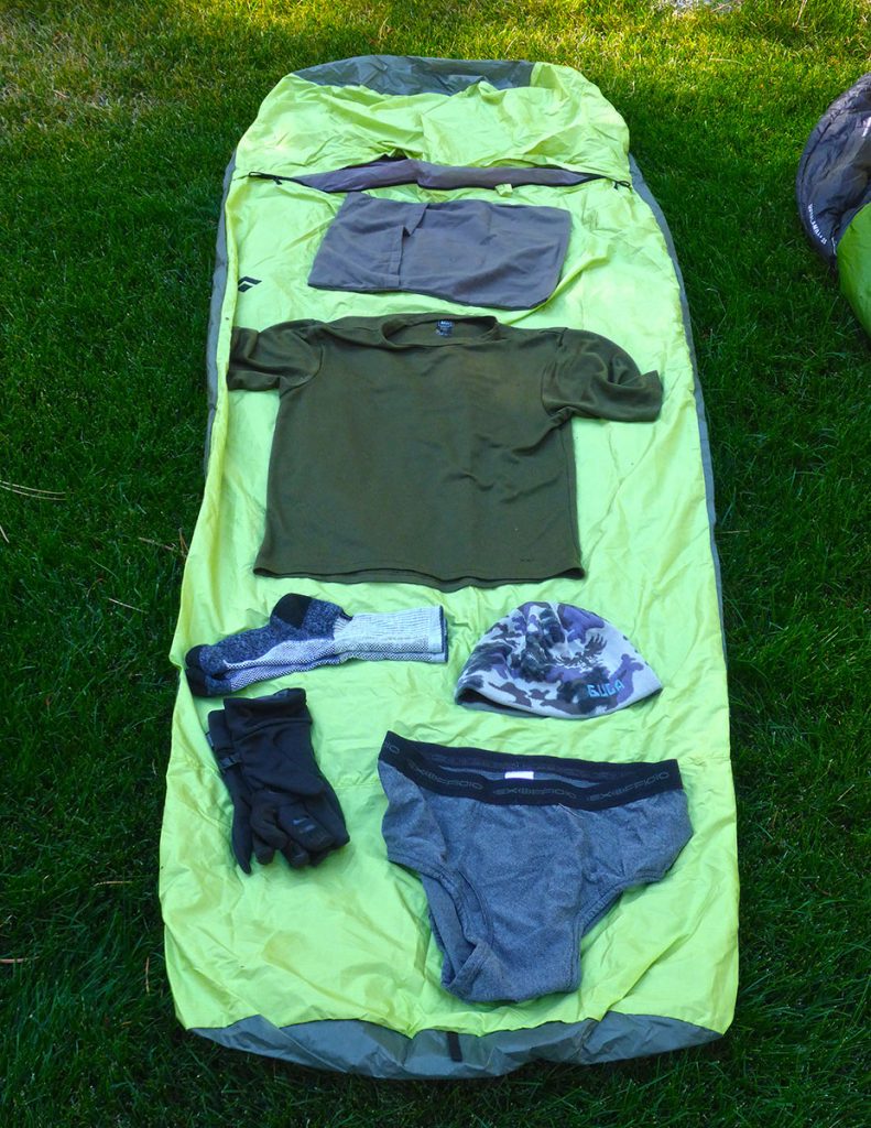 Backpacking clothing displayed on top of an ultra-lite bivy sack