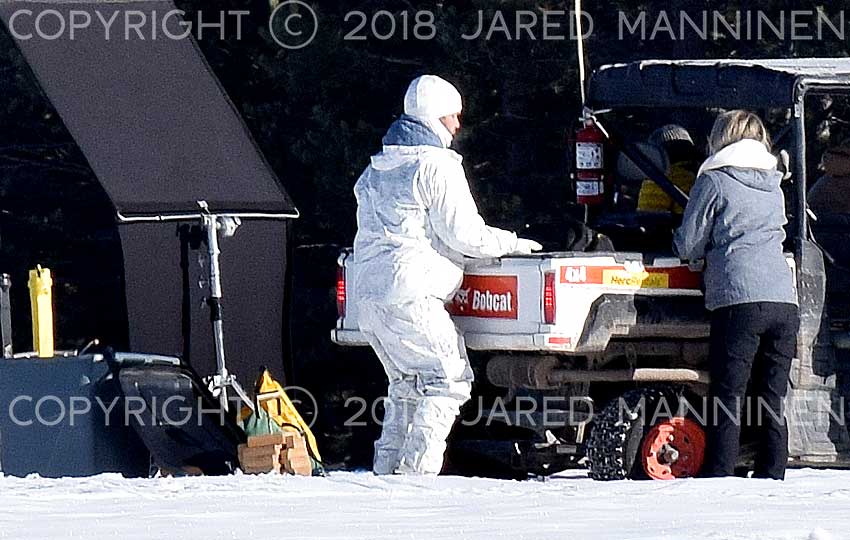 Production team member dressed in white on the set of Top Gun: Maverick