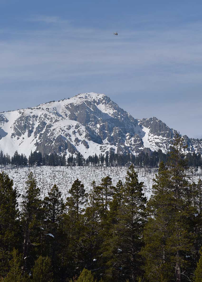 Mount Tallac with helicopter flying in the sky