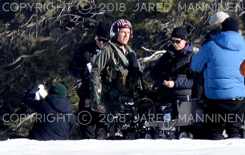 Tom Cruise looks toward the sun as he waits between scenes while filming Top Gun: Maverick