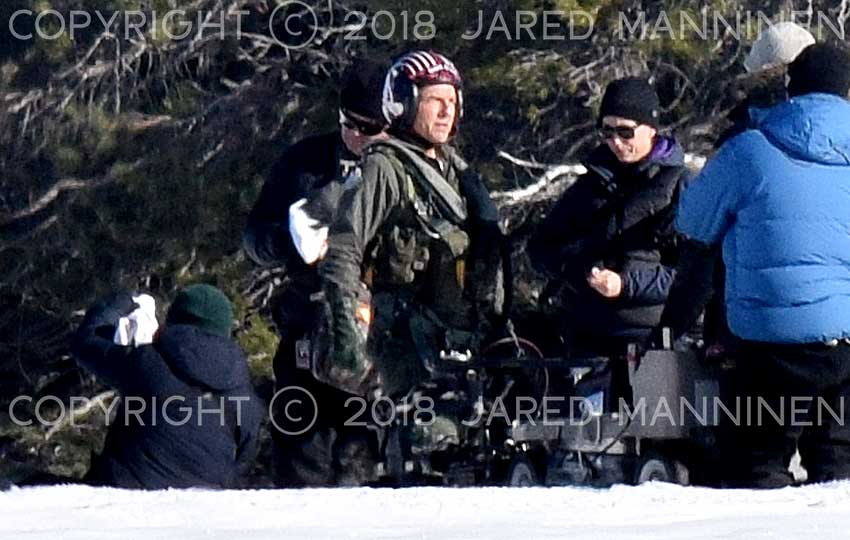 Tom Cruise looks toward the sun as he waits between scenes while filming Top Gun: Maverick