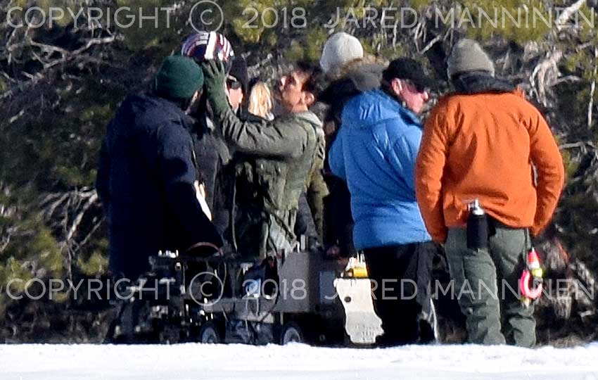 Tom Cruise inspecting his flight helmet