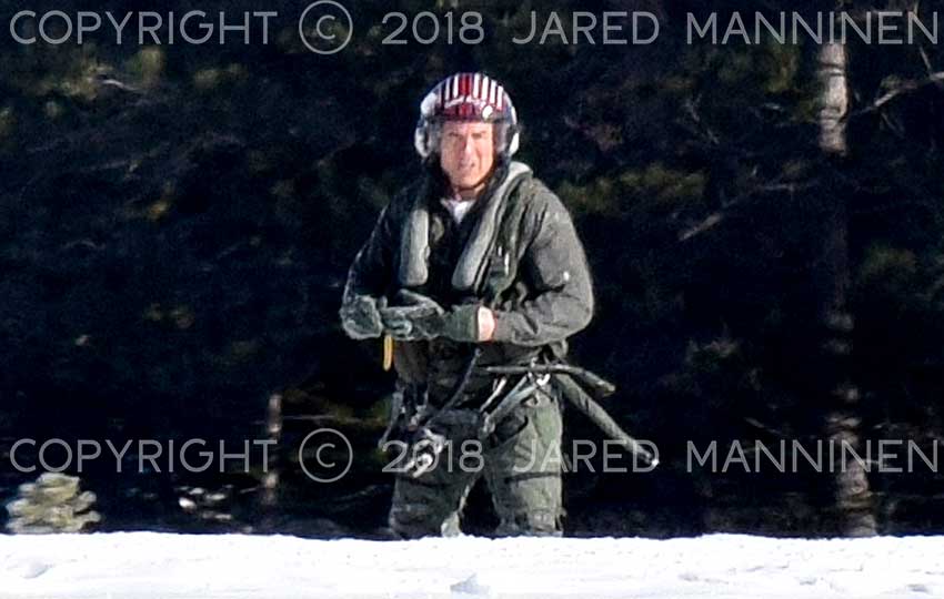 Tom Cruise staring back at the camera while filming Top Gun: Maverick