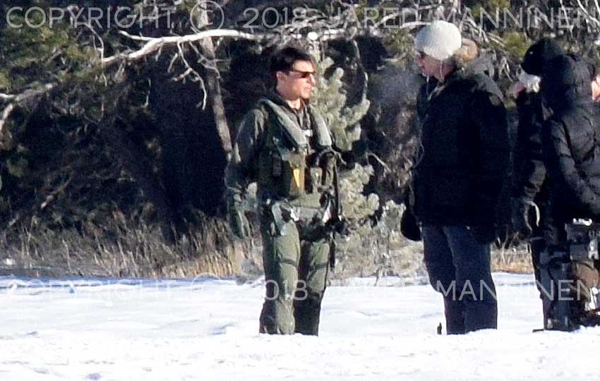 Tom Cruise talking with Top Gun: Maverick production crew members