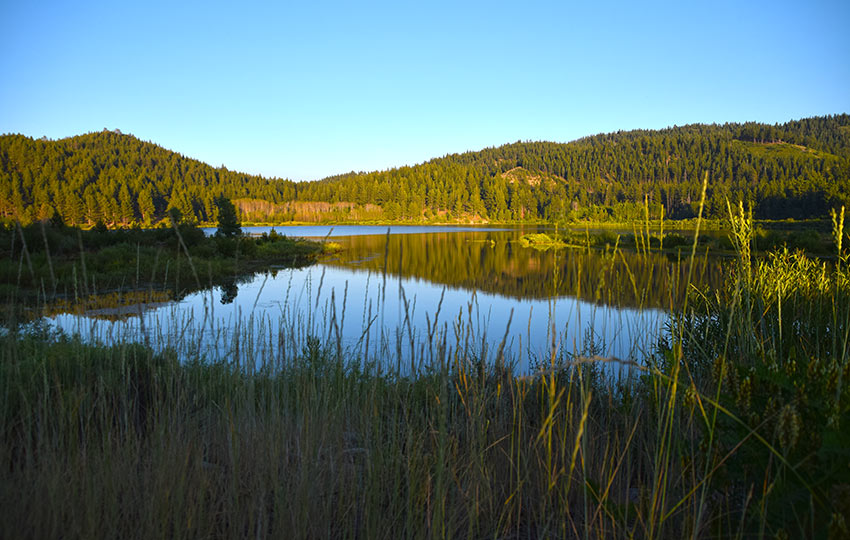 The sun setting on Spooner Lake during summer