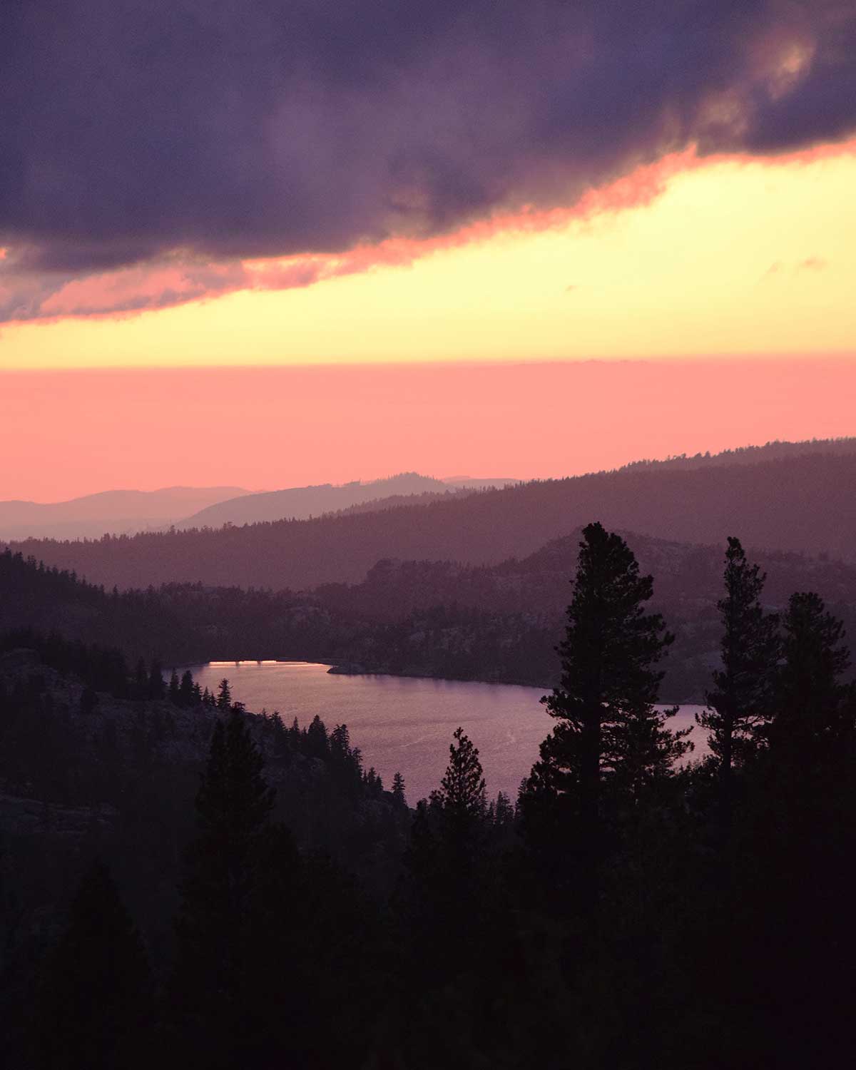 Caples Lake during a purple and gold clouded sunset