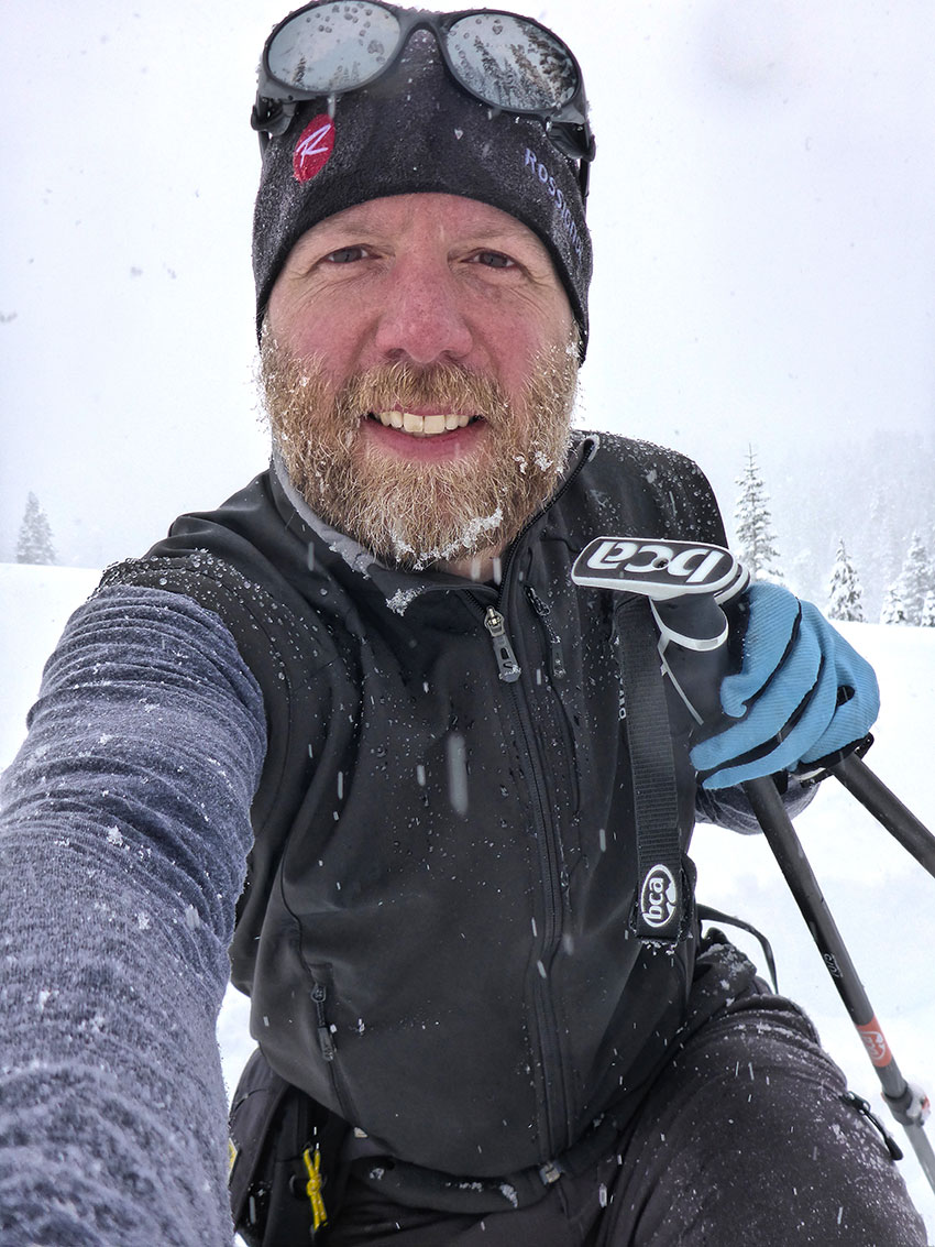 Man taking a selfie while cross-country skiing in a snowstorm