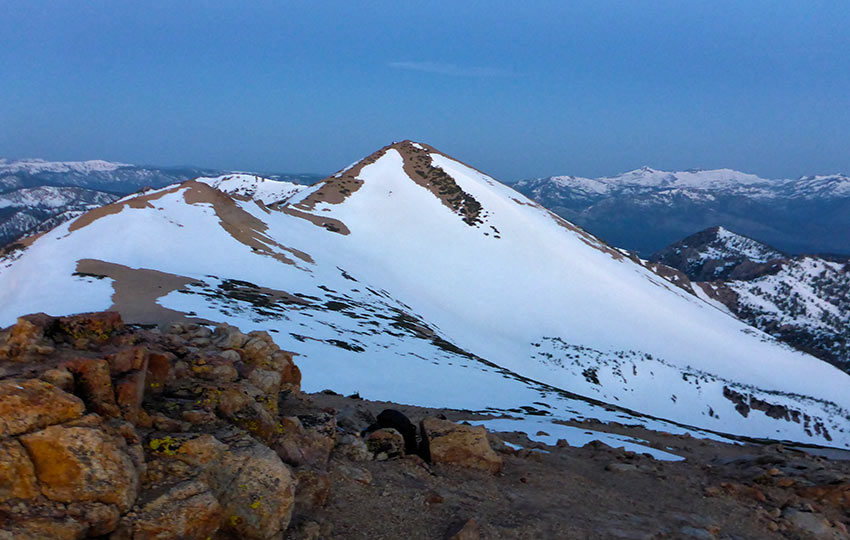 Snow-covered mountains at sunrise