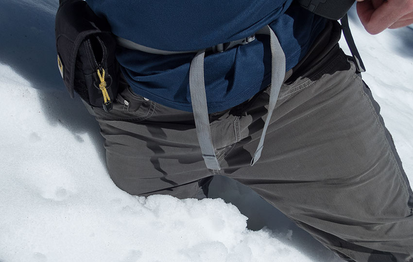 Man standing in thigh-deep snow