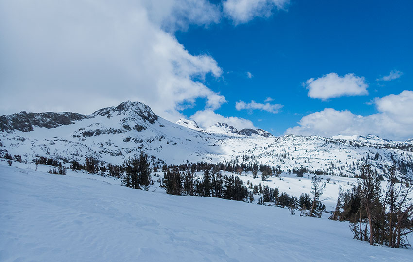 Snow-covered mountains with blue skies