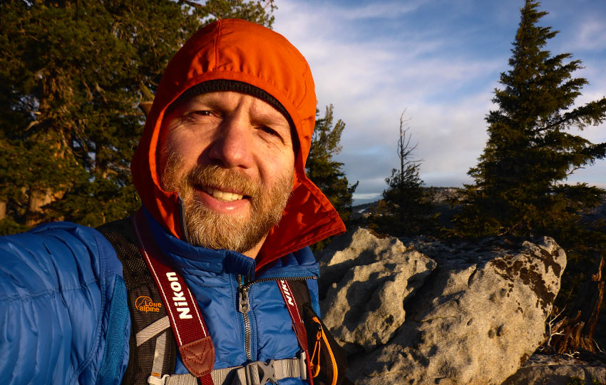 Jared Manninen on the top of Maggie's Peaks at sunrise