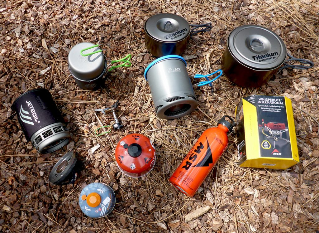 Assortment of backpacking camp stoves and cook pots