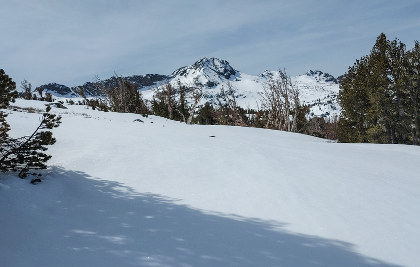 Snowbank and a mountain range.